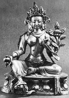 A statue of a person sitting on a pedestal



AI-generated content may be incorrect.